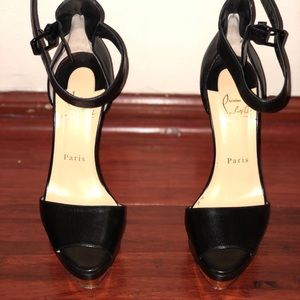 Black platform Louboutin shoes